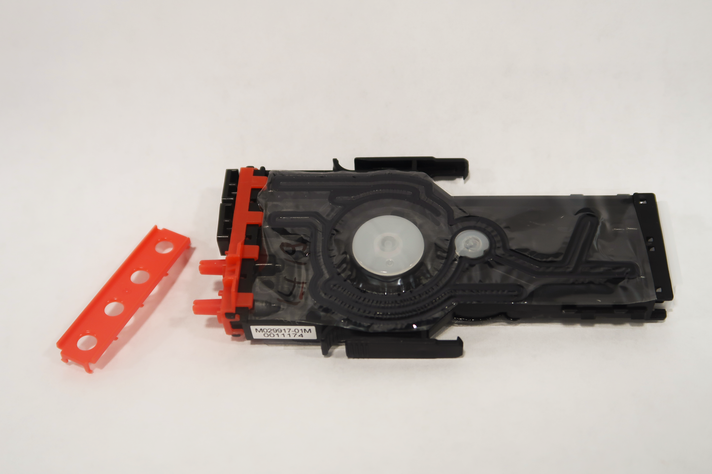 Mimaki white damper assembly with a red top on a white background