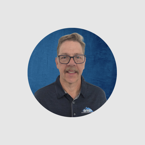 Man in round circle with logo on shirt