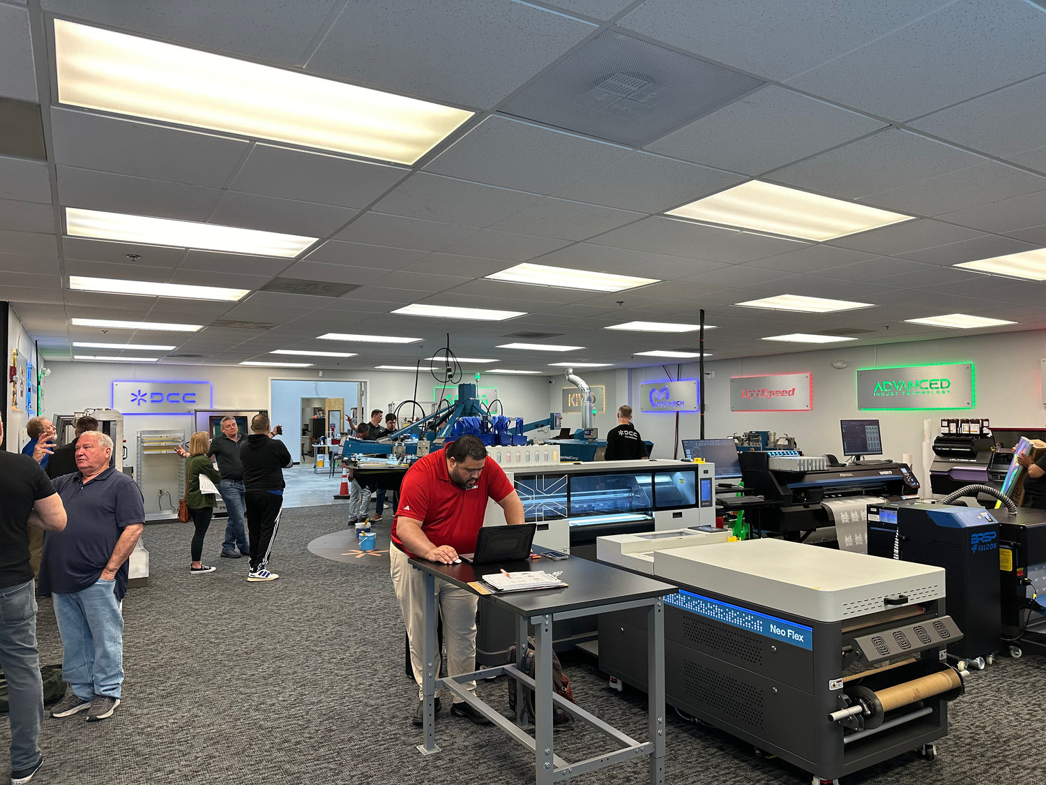 Blue Ridge Screen Products Demo room with people and large printing equipment.