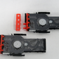 Two black printer cartridges with red clips on a white background