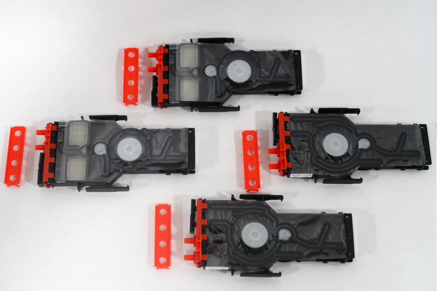 Set of black and red mechanical components on a white background