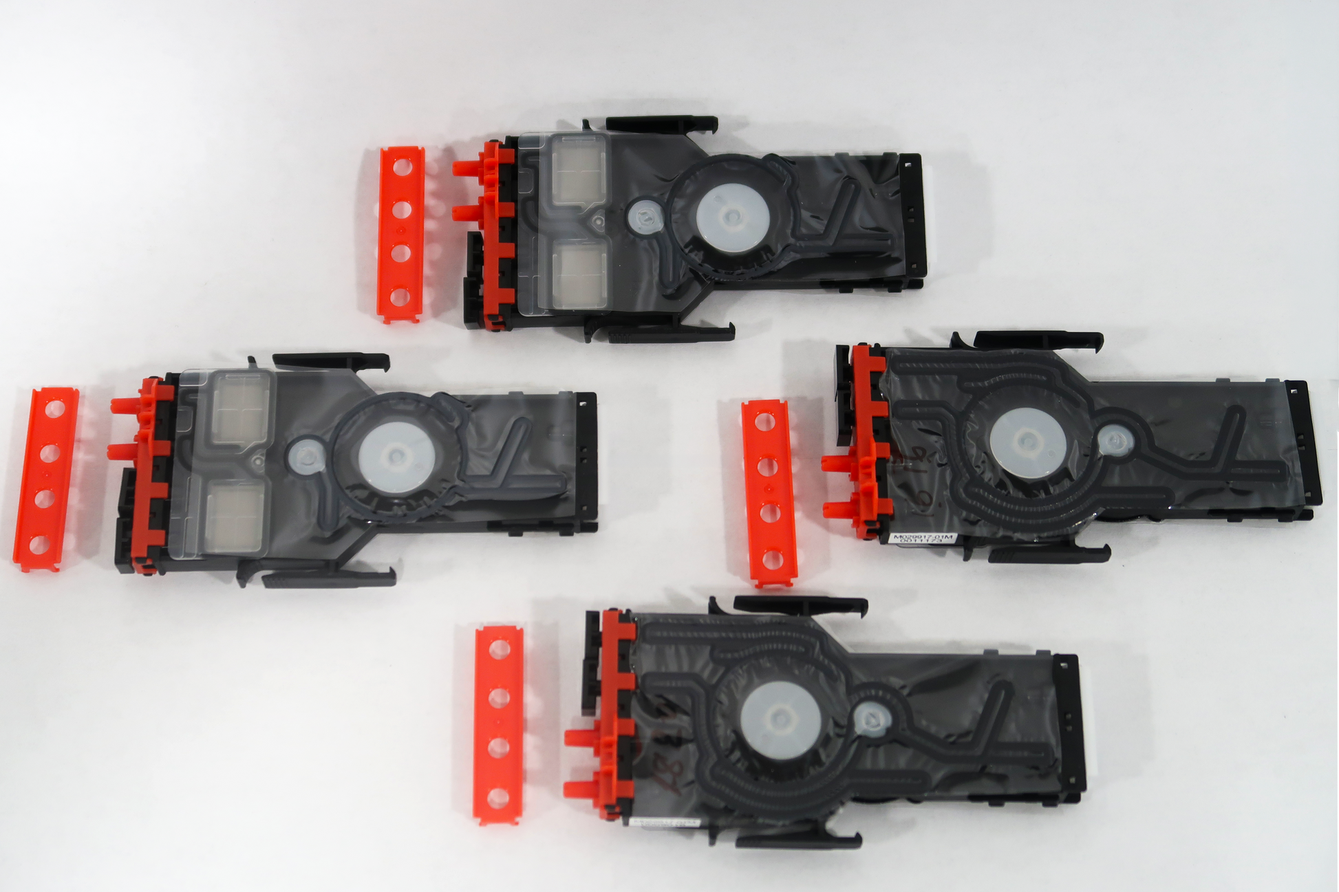 Set of black and red mechanical components on a white background